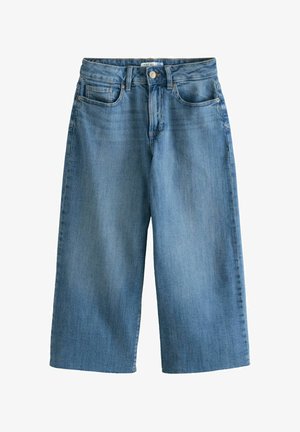 Lahtiste jalaga teksad, mis on valmistatud helesinisest denimist. Omavad nupukinnitust, vööloopse ja nelja taskut. Sile tekstuur kerge fading'iga.