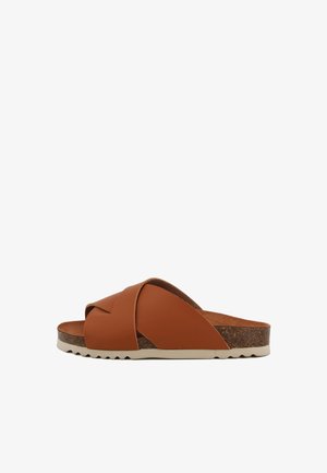 Brown leather slide sandal with crossed straps, cork insole, and textured rubber outsole. Sleek design with a low-profile shape.