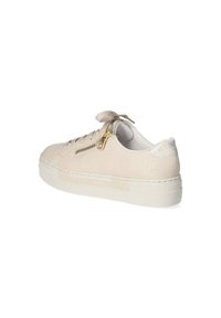 Beige sneaker with textured leather upper, rounded toe, and flat laces. Features a gold zipper on the side and a cushioned white sole.