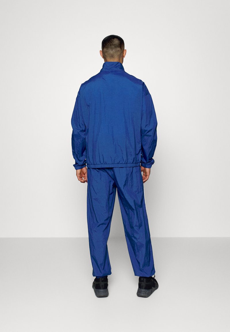 Herren Trainingsanzüge | Reebok WOR Trainingsanzug batik blue/blau - DN91677 Herren Trainingsanzüge | Reebok WOR Trainingsanzug batik blue/blau - DN91677