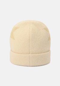 Cream wool beanie with a knitted texture, featuring a folded cuff and subtle light-colored patterns near the crown.