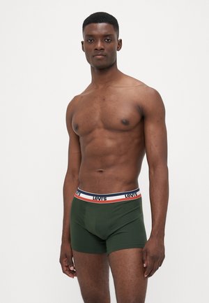 Grüne Baumwoll-Boxershorts mit einem kontrastierenden Bund, der das Levi's-Logo sowie Farben in Marineblau, Rot und Weiß zeigt. Glatte Textur, taillierte Passform.