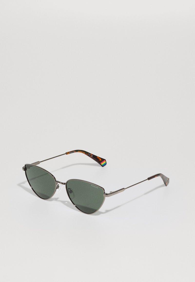 Cat-eye sunglasses with dark green lenses, metal frame, and tortoiseshell-patterned arms featuring a rainbow accent on the temple.