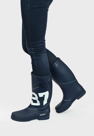 Navy rubber rain boots with a white "37" pattern, buckle accent, and textured sole, reaching mid-calf. Designed for waterproof wear.