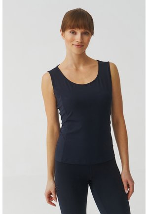 Débardeur marine en tissu lisse et extensible. Présente une encolure ronde et une coupe ajustée, idéale pour les vêtements de sport ou les tenues décontractées.