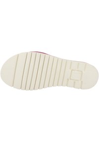 Pink sneaker sole with a textured white rubber surface. Features horizontal grooves and a brand logo embossed near the heel.