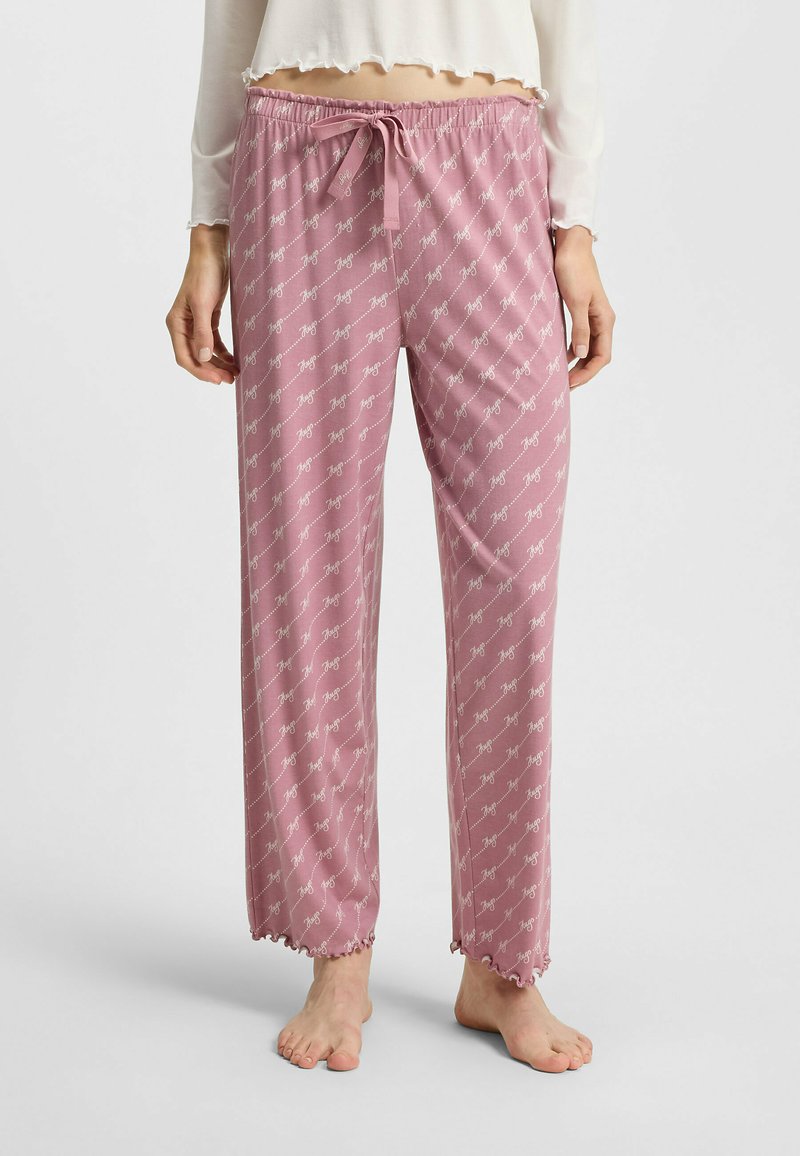 Lichtroze pyjamabroek met een elastische tailleband en trekkoord, voorzien van een herhalend wit logo-patroon en gekartelde zoom.