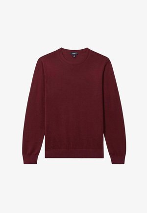 Burgundi spalvos ilgomis rankovėmis megztinis, pagamintas iš glotnaus mezgimo audinio, su apvalia iškirpte ir pūstomis rankogaliais bei iškirpte. Paprastas dizainas be raštų ar akcentų.