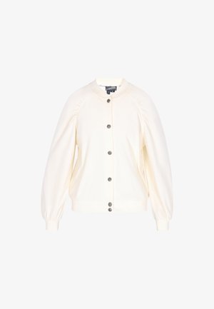 Valge, pehme kangas jakk ümmarguse kaelusega, nööbiga kinnitamine ja puhviga pikad varrukad. Omab soonikserva ja mansette.