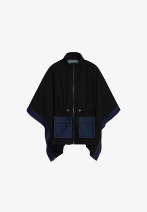 Sort poncho-lignende jakke med lynlås foran, har denimlommer og blå kant. Inkluderer justerbar snøre i taljen.