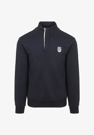 Marineblauer Pullover mit hohem Kragen, halbem Reißverschluss vorne und gerippten Bündchen. Verfügt über ein gesticktes Patch auf der Brust.