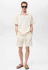 Mango XAVIS - Teplákové kalhoty - off-white
