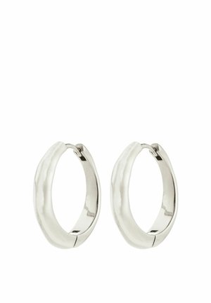 Silver hoop earrings with a smooth, textured surface and a slightly wavy shape, featuring a secure clasp for closure.