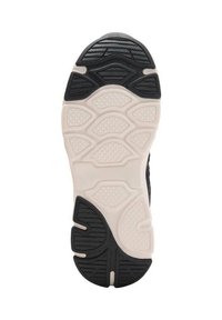 Črno-bela podplat športnega čevlja z vzorčnim, teksturiranim oprijemom; vsebuje ukrivljene dele in osrednji srednji podplat.