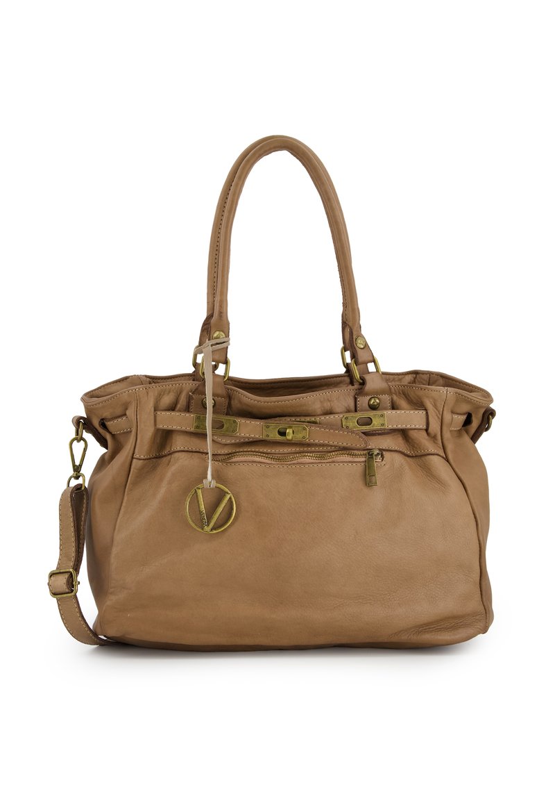 Brown leather handbag with dual handles, adjustable shoulder strap, brass accents, zippered pockets, and a circular logo charm.