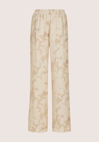 Beige Hosen mit weitem Bein, elastischem Bund und einem dezenten hellbraunen Blumenmuster auf dem gesamten Stoff.