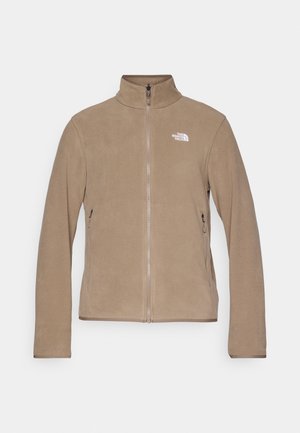 Fleece jacket in light brown with a high collar and full front zipper. Features a white logo on the left chest and side pockets.