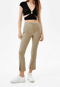 Bershka Tygbyxor - sand