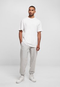 Karl Kani SMALL SIGNATURE UNISEX - Spodnie treningowe