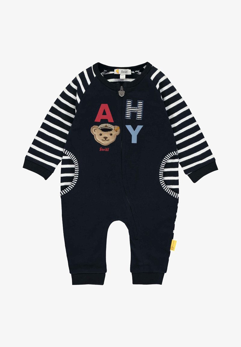 Navy-blaue Fleece-Spielanzug mit gestreiften Ärmeln, verziert mit einem Bären-Patch und den Buchstaben "A", "H" und "Y". Mit Reißverschluss und runden Taschen.