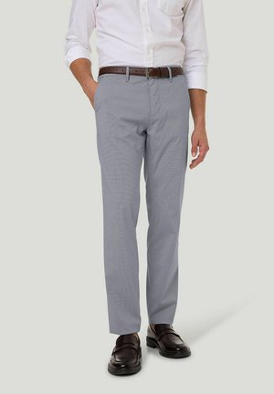 Gray patterned trousers with a tailored fit, made from lightweight fabric. Features a zip fly, side and back pockets, paired with dark shoes.