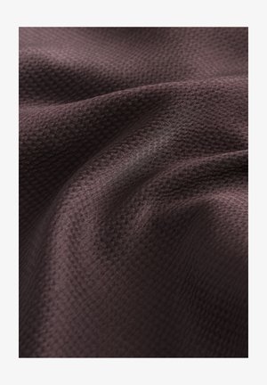 Brown textured fabric with a subtle geometric pattern, exhibiting a smooth sheen and soft drape, showcasing layered folds and ripples.
