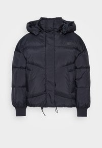 Mörk pufferjacka med hög krage och huva, med en quiltad design, elastiska muddar och justerbara dragsnören i nederkanten.