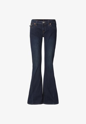 Rozkloszowane ciemnoniebieskie dżinsy z dopasowaną talią, dwoma przednimi kieszeniami i subtelnymi przeszyciami. Zapięcie na guzik i zamek błyskawiczny.