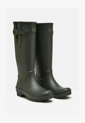 Grüne Gummiregenstiefel mit glatter Oberfläche, verstellbarer Schnallenverzierung an der Seite und einer stabilen, profilierten Sohle für guten Halt.