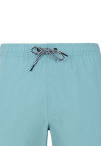 Svetlomodré plavky s elastickým pásom a čiernym a bielym šnúrkovým opaskom. Hladká tkanina bez viditeľných vzorov alebo akcentov.