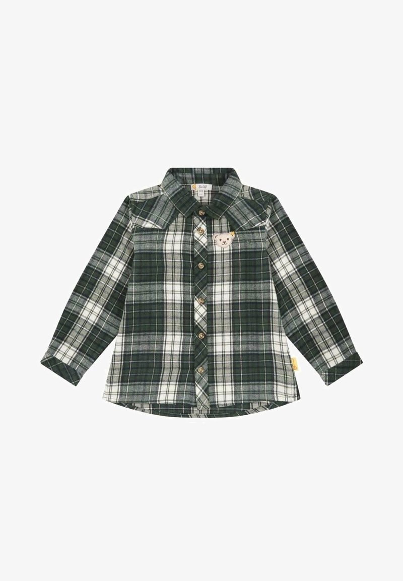 Chemise à carreaux verte et blanche à manches longues avec boutons et un petit écusson ours en peluche sur la poche poitrine gauche.