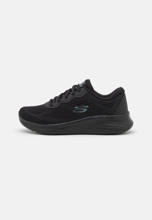 Black Skechers athletic shoe with mesh upper, lace-up front, cushioned sole, and Skechers "S" logo on side.