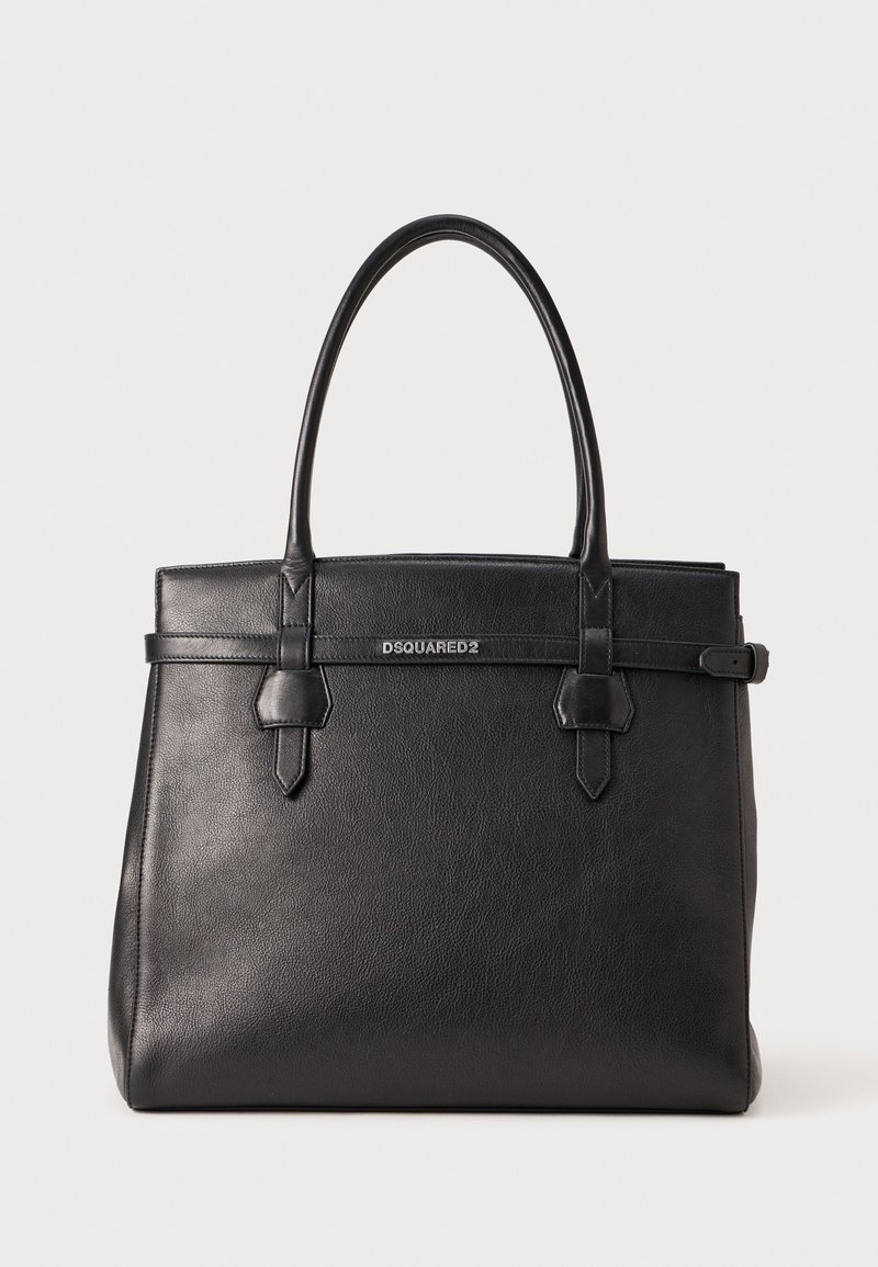 Black leather tote bag with dual handles, flat shape, and a central strap detail featuring a silver logo. Smooth texture with minimal accents.