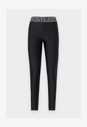 Black full-length leggings with elastic waistband featuring bold white MOSCHINO logo text.