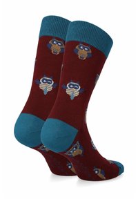 Czerwone skarpetki z turkusowymi mankietami i wzorami z kreskówkowymi szopami. Wykonane z miękkiego materiału, z detalnymi przeszyciami i kolorowymi akcentami.