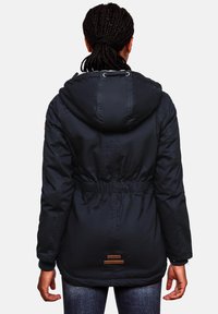 Navy puffer jacket with a fitted waist, drawstring hood, elastic cuffs, and branded tags on the lower back. Smooth texture and insulated design.