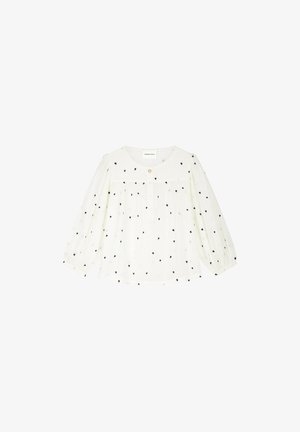 White long-sleeve blouse with black heart pattern, round neckline, single top button, and gathered fabric details on front and sleeves.