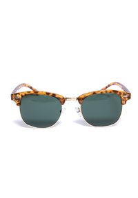 Sunglassai su vėžlio lukštu, tamsiai žali objektyvai, auksinis metalinis tiltas ir skaidrūs nosies pagalvėlės. Lengvi, klasikinio apvalaus formato.