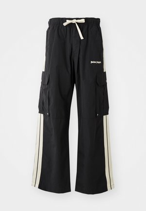 Pantalon cargo noir avec taille élastique et cordon de serrage, doté de rayures crème sur les côtés, de plusieurs poches et d'un logo sur le devant.