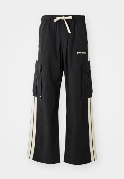 Black cargo pants with elastic waistband and drawstring, features cream side stripes, multiple pockets, and logo detail on the front.