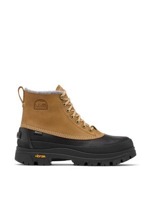 Botte d'cheville étanche avec tige en cuir beige, semelle en caoutchouc noire, doublure en polaire grise et logo Vibram jaune. Dotée d'œillets métalliques.