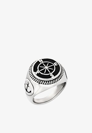 Anillo de plata con rosa de los vientos en la parte superior mostrando N, E, S, O y un símbolo de ancla en el lateral, diseño náutico.