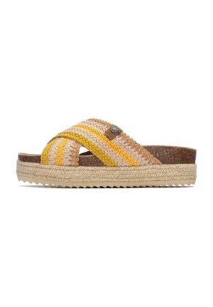 Sandalias tejidas con una correa trenzada multicolor en beige, amarillo y marrón, con una plantilla de corcho y una entresuela de yute tejido.