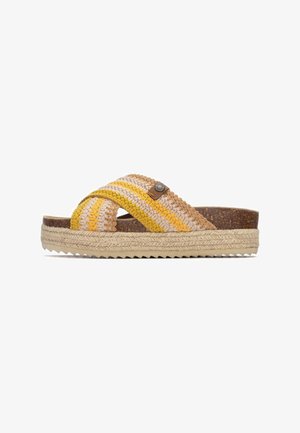 Sandalias tejidas con una correa trenzada multicolor en beige, amarillo y marrón, con una plantilla de corcho y una entresuela de yute tejido.