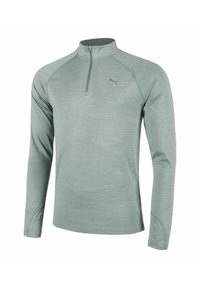 Hellegrüner, langärmeliger Sportpullover mit kurzer Reißverschlussöffnung, Raglanärmeln und reflektierendem Puma-Logo auf der Brust. Glattes, strukturiertes Material.