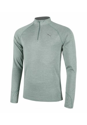 Hellegrüner, langärmeliger Sportpullover mit kurzer Reißverschlussöffnung, Raglanärmeln und reflektierendem Puma-Logo auf der Brust. Glattes, strukturiertes Material.