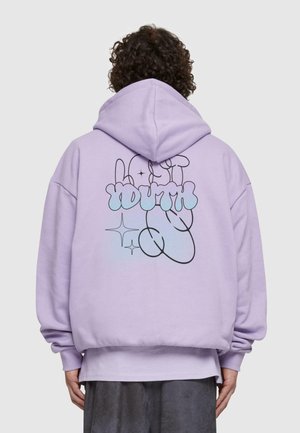 Purple oversized hoodie with a front pocket. Back features black line drawing with the words "Lost Youth" in blue and sparkles. Soft texture.