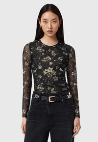 Μαύρο floral μακρυμάνικο τοπ από διαφανές διχτυωτό ύφασμα με στρογγυλή λαιμόκοψη. Διαθέτει πολύχρωμα λουλουδένια σχέδια και εφαρμοστή σιλουέτα.