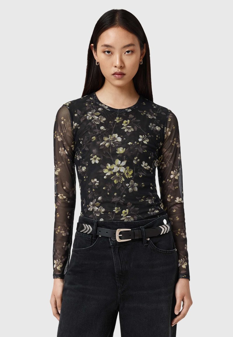 Μαύρο floral μακρυμάνικο τοπ από διαφανές διχτυωτό ύφασμα με στρογγυλή λαιμόκοψη. Διαθέτει πολύχρωμα λουλουδένια σχέδια και εφαρμοστή σιλουέτα.