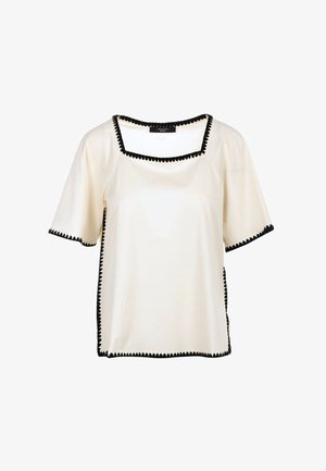 Short-sleeve, cream-colored top with a square neckline, featuring black scalloped trim along edges and sides. Soft fabric.